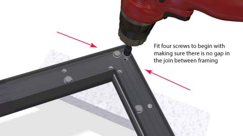 Close up of one corner showing the pattern of the four screws with a cordless drill on the last screw.