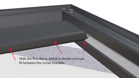 Medium close angle of slat being fitted.